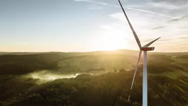 A mountain town viewed from the position of a wind turbine in the hills